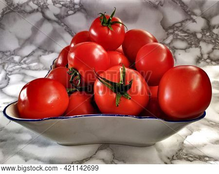 Close-up View Of A Bowl Full Of Tomatoes, Marble Background, Photo