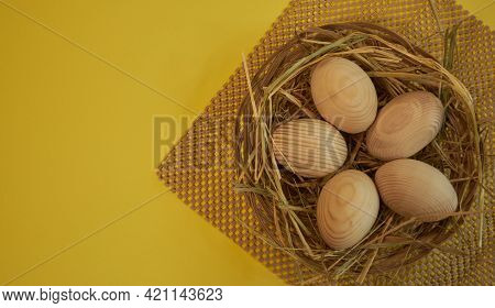 Eggs Made Of Wood, Wooden Easter Eggs Isolated On Yellow Background, Wooden Blank Eggs