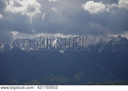 Heavy Clouds Over The Bucegi Mountains In Romania During A Spring Day, As Seen From The Hills Of Pes