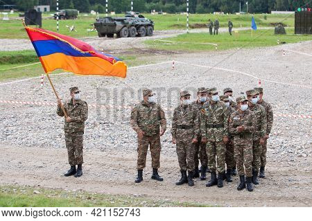 A Platoon Of Soldiers Of The Army Of Armenia In Hygienic Masks With The Flag Of The Republic Of Arme