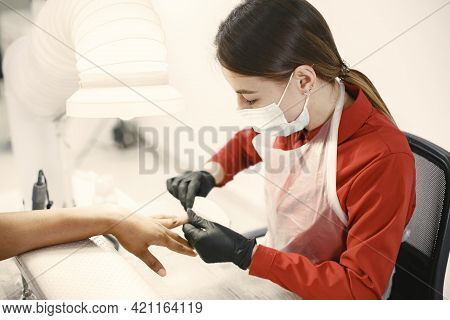 African Girl Doing Manicure In A Beauty Salon