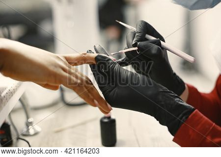 African Girl Doing Manicure In A Beauty Salon