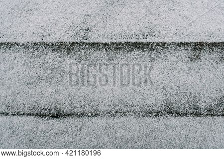 First Snow On A Pale Faded Brown And Cool Blue Reclaimed Pine Wood Surface With Aged Boards Lined Up
