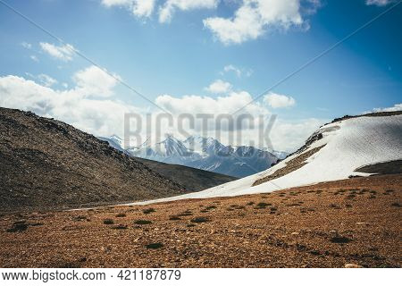Scenic Highlands Landscape With Glacier On Hills On Background Of Large Snowy Mountain With Peaked T