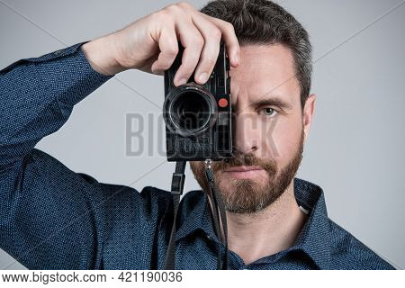 Middle-aged Photographer Take Photograph Looking In Eye Of Handheld Photo Camera, Snapshot.