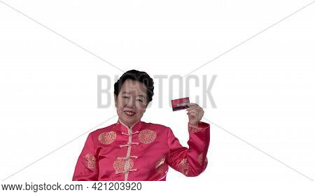 Chinese New Year Spending Credit Card. Asian Senior Woman In Constume Holding Red Card
