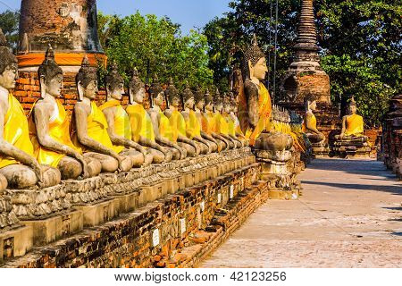AYUTTHAYA, THAILAND - JAN 5, 2011: Buddha statues at the temple of Wat Yai Chai Mongkol in Ayutthaya near Bangkok Thailand