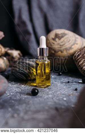 Small Glass Bottle With Natural Magic Oil. Cosmetic And Magic Elixir.