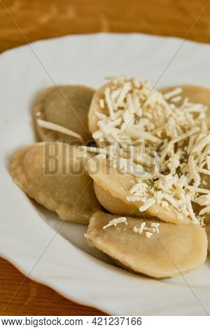 Tasty Slovak Food Pirohy Filled Dumplings With Plum Jam With Grated Tvrdy Tvaroh Quark On White Plat