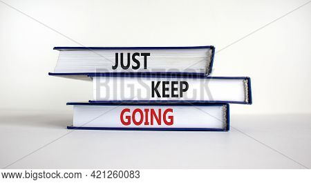 Just Keep Going Symbol. Books With Words 'just Keep Going'. Beautiful White Background. Business, Ju