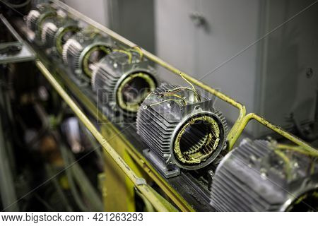 Stators Of Electric Motors On Assembly Line Of Semi-automated Manual Production. Equipment And Inter