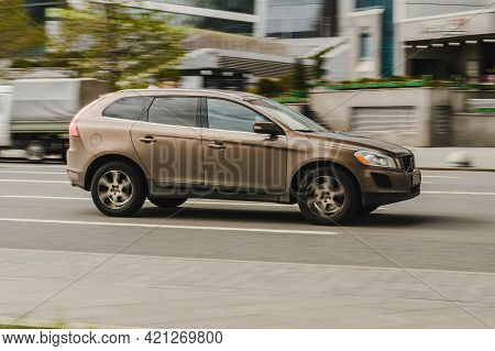 Moscow, Russia - May, 2021: Volvo Xc60 Suv In Motion. Brown Dusty Crossover Is Fast Driving On City 