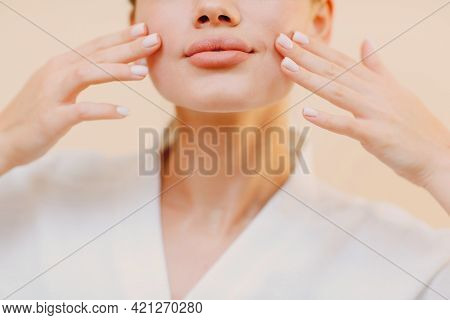 Close Up Portrait Of Young Caucasian Woman Doing Facebuilding Yoga Facial Gymnastics Yoga Massage.