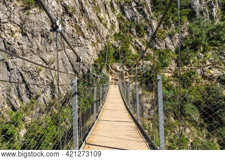 Suspension Bridges In The Loriguilla Reservoir. Ruta De Los Pantaneros In The Town Of Chulilla In Th