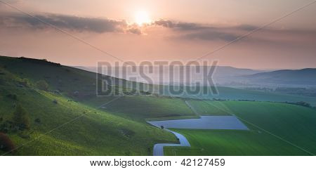 Beautiful Sunset Over Rolling Hills Countryside Landscape