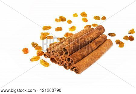 Cinnamon With Raisins On A Light Background