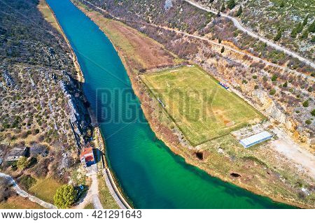Obrovac. Soccer Field By Zrmanja River Aerial View. Karst Landscape Of Obrovac, Town In Dalmatia Reg