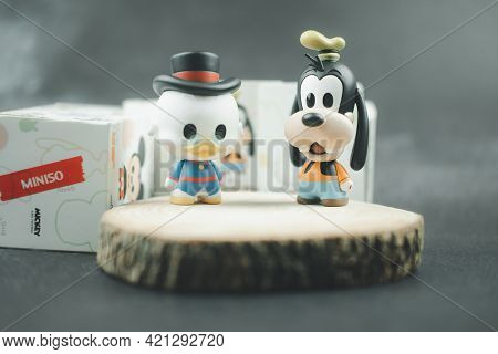 Samut Prakan, Thailand - May 22, 2021 : Cute Figurine Goofy And Scrooge Mcduck (mickey Mouse Family 