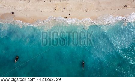 Aerial Shot Of The Mnemba Island White Sand Sandbanks Washed With Turquoise Indian Ocean Waves Near 