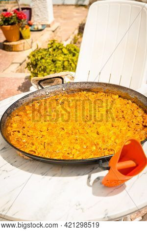 Preparation Of The Embers Of The Valencian Paella With Embers And Vegetables. Traditional Spanish Fo