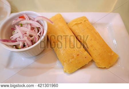 Plate Of Steamed Fresh Corn Cakes Called Humitas, A Popular Traditional Food Of The Andes Region