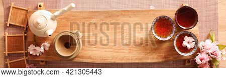 Beautiful Set For Traditional Tea Ceremony On Wooden Table, Flat Lay. Banner Design