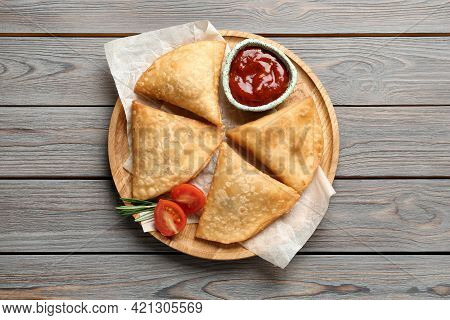 Fresh Delicious Crispy Samosas Served On Wooden Table, Top View