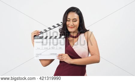 Asian Woman Is Holding Clapper Board Or Movie Slate Use In Video Production ,film, Cinema ,movies In