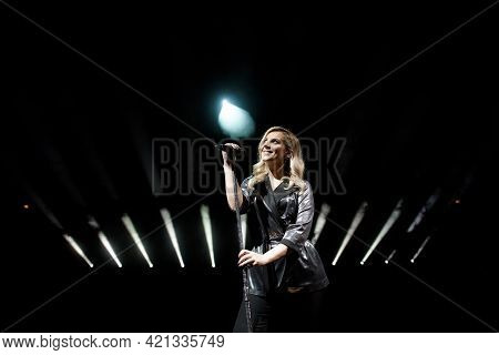 Young Beautiful Woman Singing In Whitel Smoke, Close Up.
