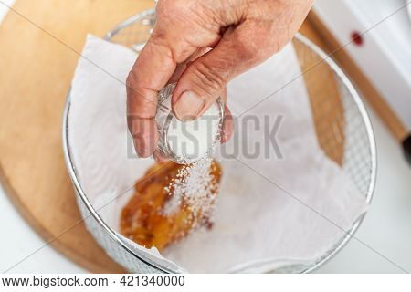 Senior Woman Preparing A Traditional Dish From El Valle Del Cauca In Colombia Called Aborrajado