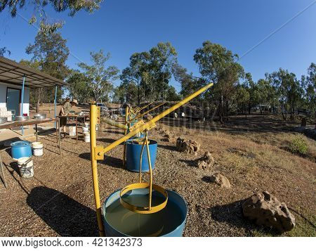 Rubyvale, Queensland, Australia - May 2021: Senior Male Retiree Looking Over Gravel For Sapphires At