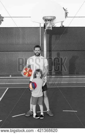 Father And Son Play Basketball. Happy Fathers Day. Happy Family. Dad And Kid Play Basketball.