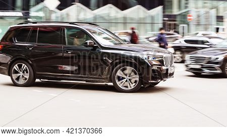 Moscow , Russia - April 2021: Side View Rolling Shot With Black Car In Motion. Bmw X7 Xdrive 40d Cro