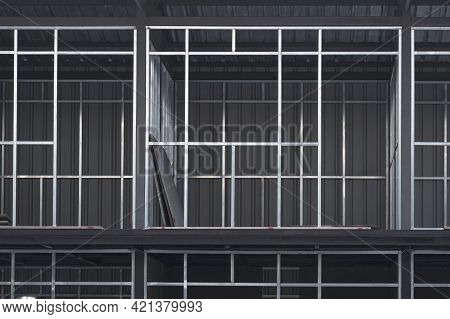 Front View Of Steel Wall Structure And Metal Sheet Roof Of Various Rooms On The Upper Floors Of 2-st