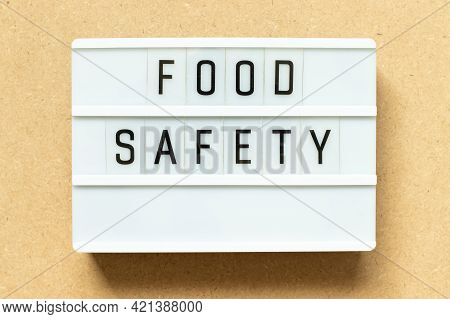Lightbox With Word Food Safety On Wood Background