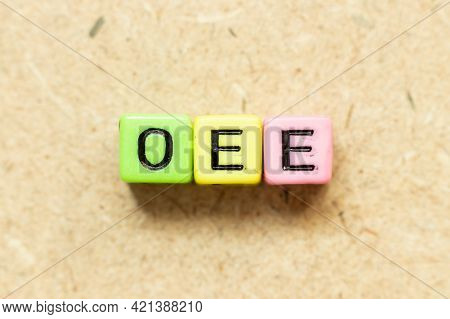 Color Alphabet Letter Block In Word Oee (abbreviation Of Overall Equipment Effectiveness) On Wood Ba