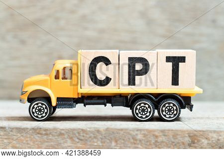 Toy Truck Hold Alphabet Letter Block In Word Cpt (abbreviation Of Carriage Paid To) On Wood Backgrou