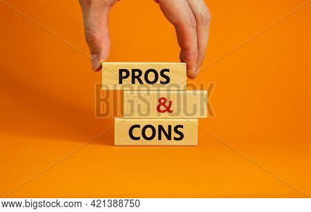Pros And Cons Symbol. Wooden Blocks With Words 'pros And Cons'. Beautiful Orange Background, Busines