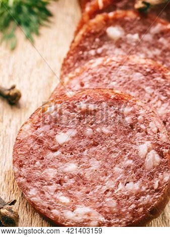 Sliced Pieces Of Salami Sausage On Wooden Board, Harmful Fast Food, Fatty Not Healthy Food, Close-up