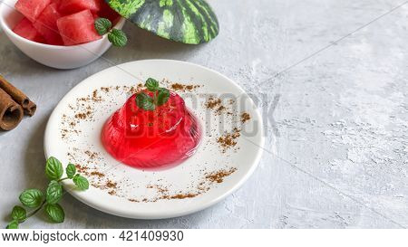 Gelo Di Melone, Pudding, Jelly With Mint And Cinnamon On A White Plate On A Light Background. Homema