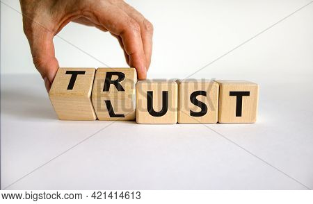 Lust Or Trust Symbol. Businessman Turns Wooden Cubes And Changes The Words 'lust' To 'trust'. Beauti