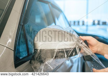 Installing Ppf Or Paint Protection Film Or Anti-gravel Protection Coating On Car Mirror. Car Detaili