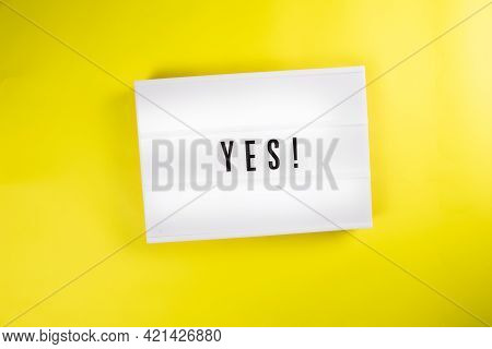Lightbox With Message Yes Isolated On Yellow Background. Concept Of Positive Decision, Answer, Choic