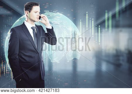 Global Trading Concept With Businessman Talking To Cell Phone On Digital Wall Vackground With Glowin
