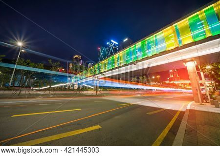 modern buildings in china shenzhen futian CBD from elevated walkway at night