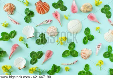 Summer Background. Seashells And Petals Of Summer Flowers On A Minimal Blue Background. Place For Yo