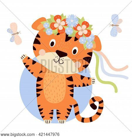 Cute Tiger Cub With A Floral Wreath With Colorful Ribbons On His Head. Butterflies Are Flying Nearby