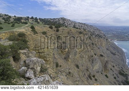 A Steep Cliff At A Small Plateau At The Top Of Cape Alchak. Sudak, Crimea. Cloudy Day At The End Of 