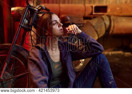 Drug addict woman smokes cigarette while she high