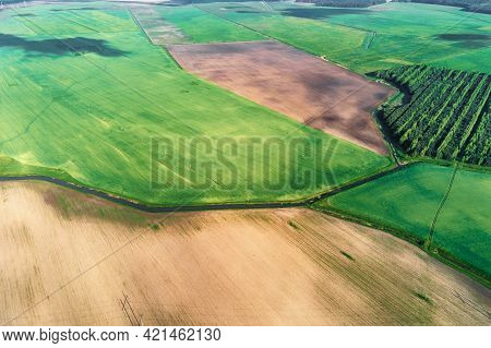 Aerial View Of Agricultural And Green Fields In Countruside. Nature Landscape In Summer Day